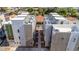 Aerial view of modern townhomes featuring rooftop patios and sleek design, enhancing the property's urban appeal at 4220 N 32Nd St # 14, Phoenix, AZ 85018