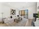 Bright living room featuring sleek hardwood floors, and modern décor, with a sliding glass door to the outside at 4220 N 32Nd St # 14, Phoenix, AZ 85018