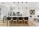 Open-concept living space featuring bar stool seating, modern kitchen, and inviting living area, perfect for entertaining at 4220 N 32Nd St # 14, Phoenix, AZ 85018