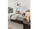 Well-lit bedroom featuring modern decor, a ceiling fan, and a balcony view at 4220 N 32Nd St # 14, Phoenix, AZ 85018