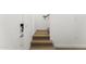 Modern staircase featuring sleek lines and light wood treads complemented by white walls at 4220 N 32Nd St # 14, Phoenix, AZ 85018