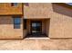 Backyard patio with stucco wall, sliding glass door, and concrete pavers at 4745 W Fremont Rd, Laveen, AZ 85339