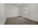 Bright, carpeted bedroom featuring a window for natural light at 4745 W Fremont Rd, Laveen, AZ 85339