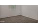 Bedroom featuring neutral carpet, white walls, window with blinds, and baseboard trim at 4745 W Fremont Rd, Laveen, AZ 85339
