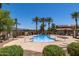 Beautiful community pool with palm trees, landscaping, and plenty of space at 4745 W Fremont Rd, Laveen, AZ 85339