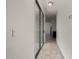 Hallway with ceramic tile leads to the kitchen and sliding glass door at 4745 W Fremont Rd, Laveen, AZ 85339
