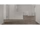 Upstairs hallway featuring carpet, white walls, and access to other rooms at 4745 W Fremont Rd, Laveen, AZ 85339