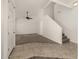 Bright and airy living room featuring neutral walls, carpet, tile flooring, and a ceiling fan at 4745 W Fremont Rd, Laveen, AZ 85339