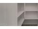 This is a storage pantry with white walls and multiple shelves at 4745 W Fremont Rd, Laveen, AZ 85339