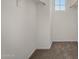 Walk-in closet featuring neutral carpet, white walls, and a window at 4745 W Fremont Rd, Laveen, AZ 85339