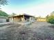 Spacious backyard featuring a covered patio and mature landscaping at 4902 S Fair Ln, Tempe, AZ 85282