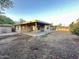Spacious backyard featuring a covered patio and mature landscaping at 4902 S Fair Ln, Tempe, AZ 85282