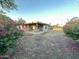 Lush backyard with blooming bushes and covered patio at 4902 S Fair Ln, Tempe, AZ 85282