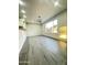 Spacious dining room with tile floors, modern lighting, and a large window allowing for ample natural light at 4902 S Fair Ln, Tempe, AZ 85282