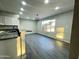 Open-concept kitchen features granite countertops, modern appliances, and sleek tile floors at 4902 S Fair Ln, Tempe, AZ 85282