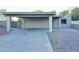 Exterior home elevation featuring a carport, xeriscaping, and neutral color palette at 4902 S Fair Ln, Tempe, AZ 85282