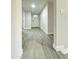 Inviting hallway with neutral paint and tile flooring, leading to the home's main entrance at 4902 S Fair Ln, Tempe, AZ 85282