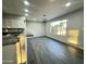 Open-concept kitchen features granite countertops, modern appliances, and sleek tile floors at 4902 S Fair Ln, Tempe, AZ 85282
