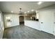 Open concept features tile floors, updated appliances, and a modern light fixture at 4902 S Fair Ln, Tempe, AZ 85282