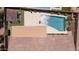 Backyard aerial view featuring a large refreshing pool with a rock feature and turf at 5737 W Hidalgo Ave, Laveen, AZ 85339
