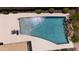 Aerial view of a private backyard pool with waterfall feature and lounge area at 5737 W Hidalgo Ave, Laveen, AZ 85339