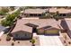 Spacious home with a three-car garage and well-maintained landscaping at 5737 W Hidalgo Ave, Laveen, AZ 85339