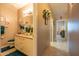 Hallway view into bathroom featuring granite countertops at 5737 W Hidalgo Ave, Laveen, AZ 85339