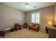 Neutral bedroom featuring wicker furniture set with a carpet floor and a ceiling fan at 5737 W Hidalgo Ave, Laveen, AZ 85339