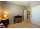 Carpeted bedroom with dresser and a door that accesses the hallway at 5737 W Hidalgo Ave, Laveen, AZ 85339