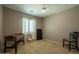 Bedroom with a foosball table, window, and neutral carpet at 5737 W Hidalgo Ave, Laveen, AZ 85339