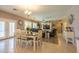 Bright dining area adjacent to the living room, featuring a dining table and views of the backyard at 5737 W Hidalgo Ave, Laveen, AZ 85339