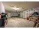 Spacious garage with ample storage and a large overhead door at 5737 W Hidalgo Ave, Laveen, AZ 85339