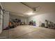 Well-lit garage with ample storage and a large open space at 5737 W Hidalgo Ave, Laveen, AZ 85339