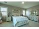 Serene bedroom with neutral tones, plantation shutters, a comfortable bed, and ample closet space at 5737 W Hidalgo Ave, Laveen, AZ 85339