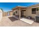 The backyard featuring a covered patio and beautiful rocky landscaping in the yard at 64 N 63Rd St # 25, Mesa, AZ 85205