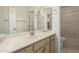 Well-lit bathroom featuring a clean vanity and a glimpse of the toilet and tub at 64 N 63Rd St # 25, Mesa, AZ 85205
