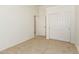 Carpeted bedroom includes a closet and a door to the other rooms in the house at 64 N 63Rd St # 25, Mesa, AZ 85205