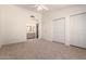 Large bedroom with neutral carpet flooring, direct access to the bathroom at 64 N 63Rd St # 25, Mesa, AZ 85205