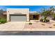 Charming single-story home featuring a two-car garage and low maintenance landscaping at 64 N 63Rd St # 25, Mesa, AZ 85205