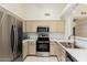 Modern kitchen with stainless steel appliances and marble countertops at 64 N 63Rd St # 25, Mesa, AZ 85205