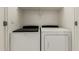 Laundry closet featuring a newer model Whirlpool washing machine and Whirlpool dryer set at 64 N 63Rd St # 25, Mesa, AZ 85205