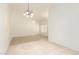 The living area has a carpet insert, and the ceiling is well lit with two light fixtures at 64 N 63Rd St # 25, Mesa, AZ 85205