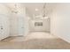 Open-concept living room with tile flooring leading into the kitchen area at 64 N 63Rd St # 25, Mesa, AZ 85205