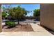 View of a quiet residential street with mature trees, creating a peaceful atmosphere at 64 N 63Rd St # 25, Mesa, AZ 85205