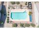 Aerial view of sparkling community pool with surrounding deck and lounge chairs at 64 N 63Rd St # 25, Mesa, AZ 85205