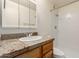 Cozy bathroom with granite vanity top and standing shower at 6606 N 46Th Ave, Glendale, AZ 85301