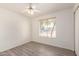 A compact bedroom with wood-look floors and natural light at 6606 N 46Th Ave, Glendale, AZ 85301