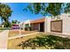 Charming home exterior with decorative tile roof and cozy front patio with a sign post on the left at 6606 N 46Th Ave, Glendale, AZ 85301