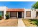 Charming home exterior with decorative tile roof, cozy front patio and easy access to the front door at 6606 N 46Th Ave, Glendale, AZ 85301
