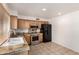 Bright kitchen features wood cabinets, stainless steel appliances, and granite countertops at 6606 N 46Th Ave, Glendale, AZ 85301